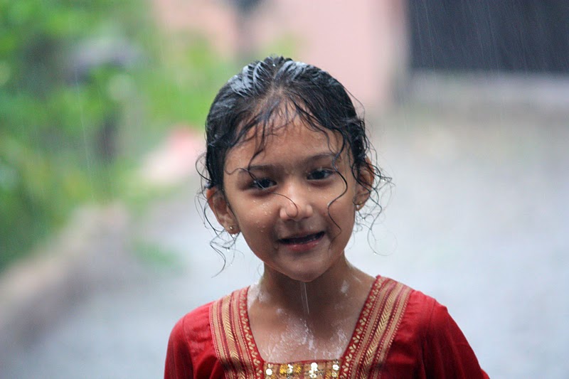 Pihu playing in the summer rain